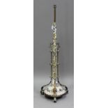 A late Victorian brass mounted and glazed porcelain adjustable floor-standing lamp standard, the
