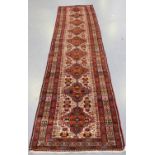 A Beluche runner, Afghan/Persian borders, late 20th century, the ivory field with a single column of