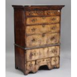 A George I walnut chest-on-stand, the moulded top above two short and three long drawers, the base