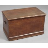 A late Victorian scumbled pine trunk, the hinged lid and sides with painted faux oak finish,