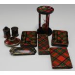 A group of Tartan ware items including two bezique markers, a sand timer, two tape measure cases and