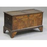 An early 20th century Italian stained beech and marquetry inlaid coffer, the panelled top above