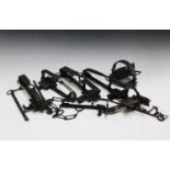 A large group of various wrought metal gin traps and other various forms of spring traps.Buyer’s