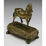 A late 18th/early 19th century Venetian gilt cast bronze model of a horse, standing on a canted