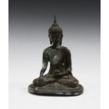 A 20th century South-east Asian bronzed copper model of a seated Buddha, height 20.5cm.Buyer’s