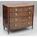 A late George III mahogany bowfront chest of four graduated long drawers with later fitted pressed