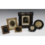 A group of four Victorian ambrotypes, a miniature watercolour of a boy and a framed photograph.