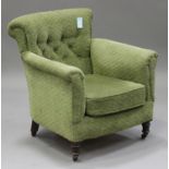 A late Victorian tub back armchair, upholstered in green fabric, on turned legs, height 79cm,