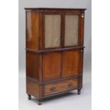 A Regency mahogany three-section side cabinet, fitted with a pair of gilt metal trellis panel
