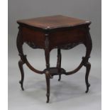 An Edwardian mahogany drinks table by Alexander Clark, London, the double-hinged top enclosing a
