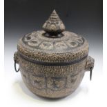 A 20th century Indian black patinated copper jar and cover, the top and sides worked with overall