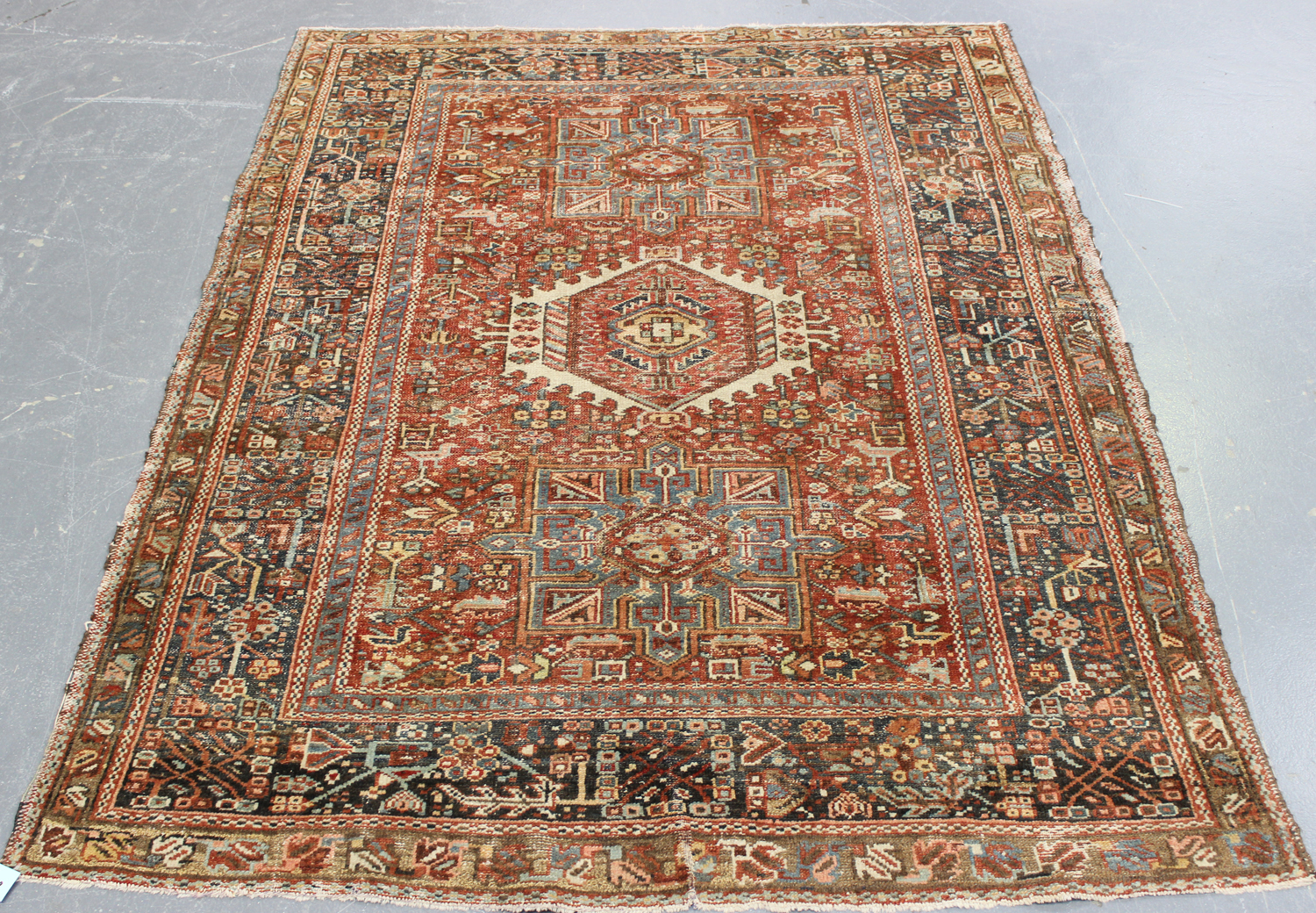 A Karajar rug, North-west Persia, early 20th century, the terracotta field with three bold