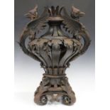 A 20th century French wrought iron ornamental urn, the strapwork baluster body with leaf mounts