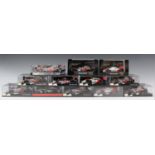 Twelve Minichamps 1:43 scale model McLaren Formula 1 cars, all within plastic display cases, two