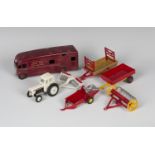 A small collection of Dinky Toys farm items, comprising a No. 325 David Brown tractor with disc