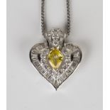 A white gold, diamond and yellow gem set stylized heart shaped pendant, mounted with a pear shaped