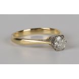 An 18ct gold and diamond single stone ring, claw set with a circular cut diamond, ring size approx