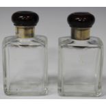 A pair of George V silver mounted rectangular cut glass scent bottles with faux tortoiseshell and