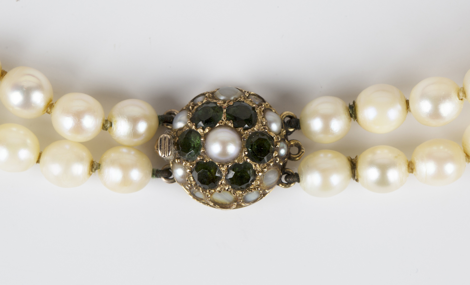 A two row necklace of graduated cultured pearls with a 9ct gold, green gemstone and half-pearl set - Image 2 of 2
