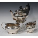 A George V silver three-piece tea set of oval form, comprising teapot, milk jug and sugar bowl,