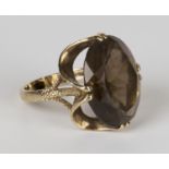 A 9ct gold ring, claw set with an oval cut smoky quartz, ring size approx O1/2, with a box.Buyer’s