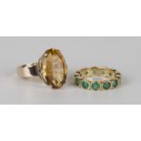 A gold and emerald full eternity ring, mounted with circular cut emeralds, ring size approx K1/2,