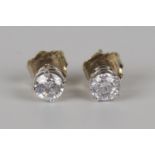A pair of 14ct white gold and clarity enhanced diamond single stone earstuds with post fittings,