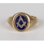 A 9ct gold and blue enamelled signet ring, the oval centre rotating to show Masonic square and