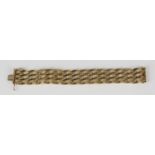 A 9ct gold bar link bracelet in a textured and plain design, on a snap clasp, with fold-over