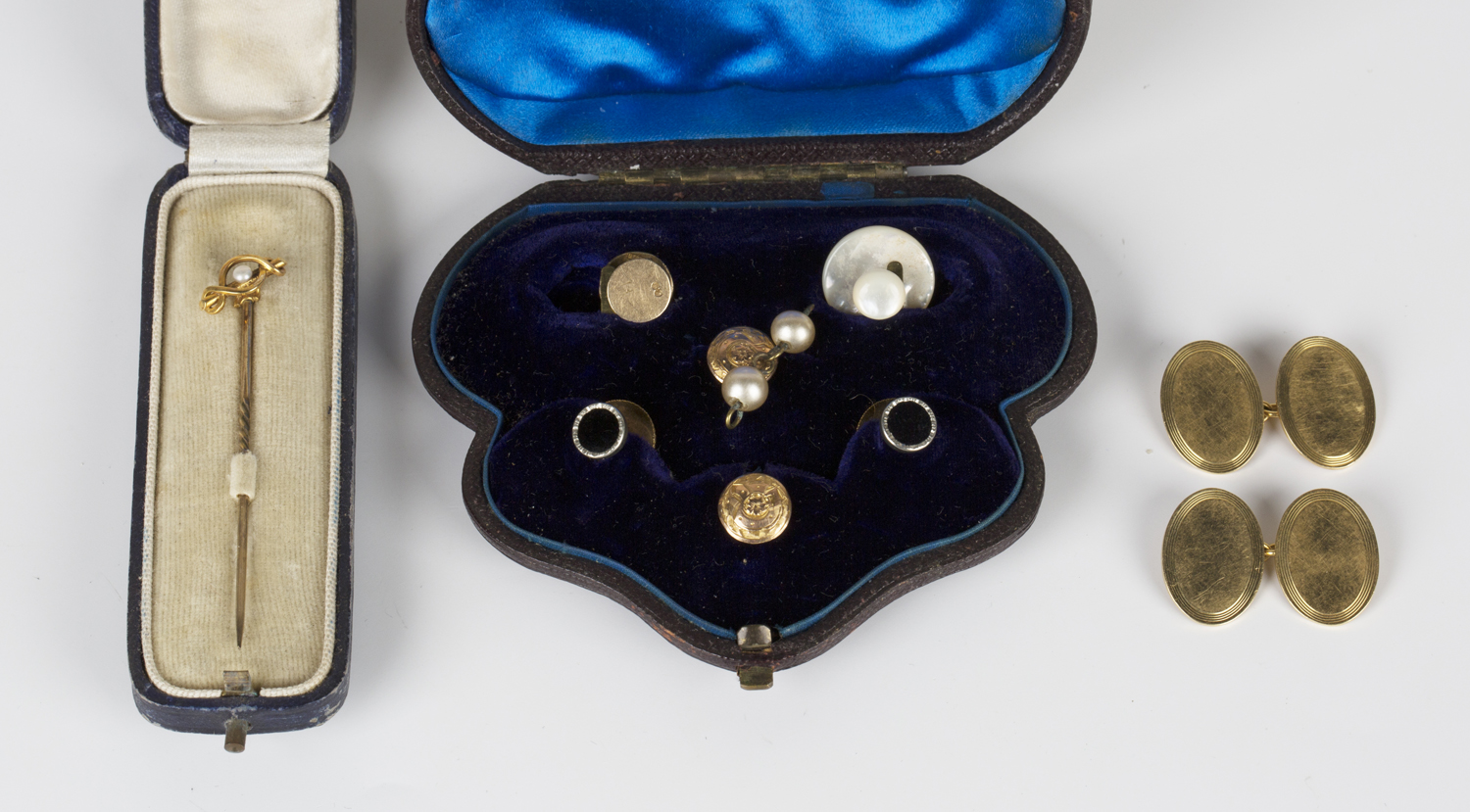 A pair of 18ct gold oval cufflinks, the backs and fronts with engine turned borders, Birmingham