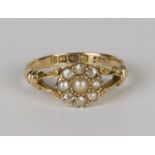 An 18ct gold, cultured pearl and diamond cluster ring, mounted with three half-pearls and six rose