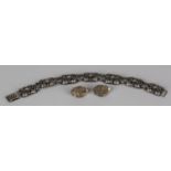 An N.E. From silver bracelet, the links of rectangular form with floral and foliate decoration,