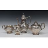 A Victorian silver four-piece tea set, each decorated in relief with oval panels filled with