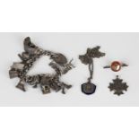 A group of silver jewellery, comprising a curblink charm bracelet, fitted with a variety of