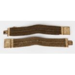Two Regency hairwork bracelets, each fitted with a square engraved snap clasp, both with