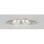A pair of 18ct white gold, cultured pearl and diamond pendant earrings, each cultured pearl