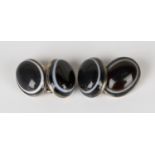 A pair of silver and banded agate set cufflinks, each front and back mounted with an oval banded