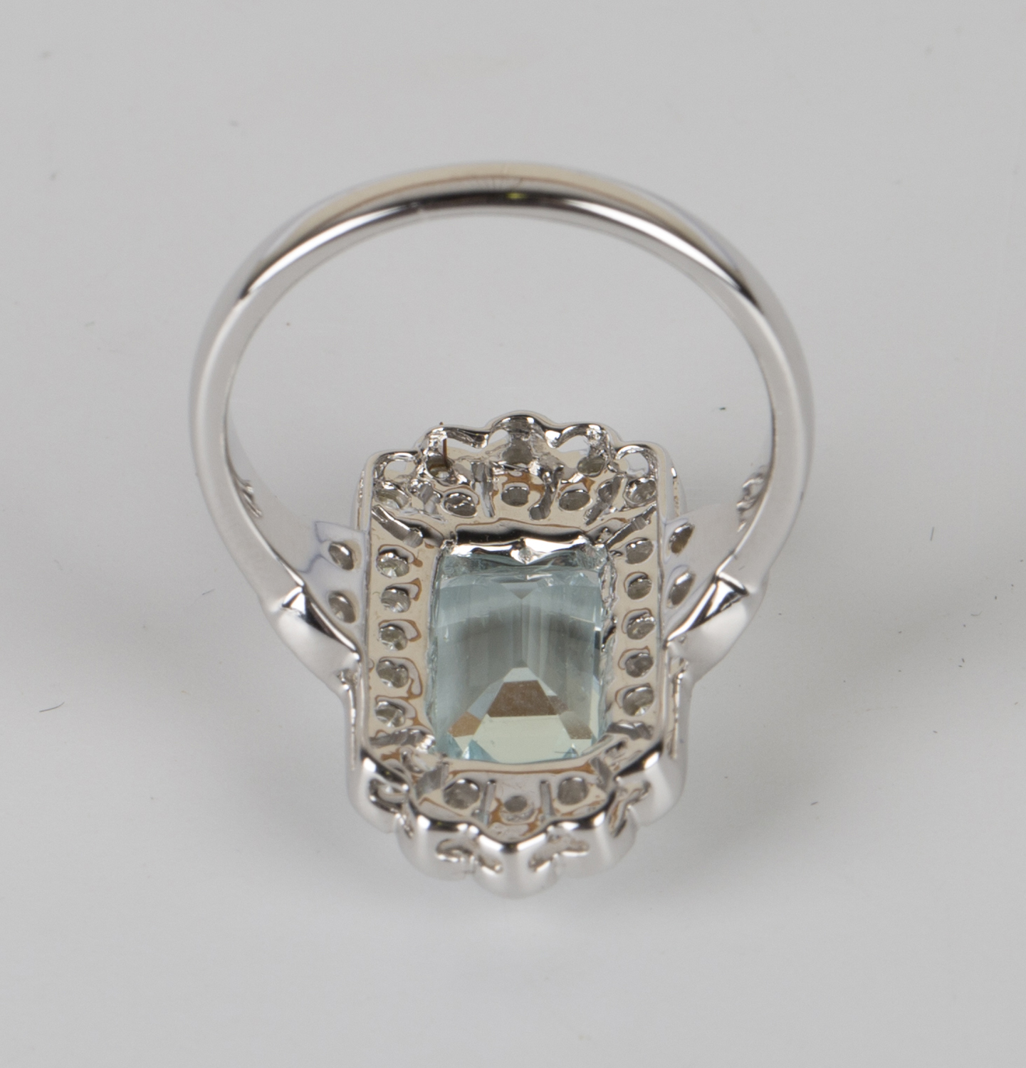 An 18ct white gold, aquamarine and diamond ring, claw set with a rectangular cut aquamarine within a - Image 2 of 2