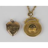 A 9ct gold pendant fob medallion, presentation inscribed, Birmingham 1928, with a 9ct gold