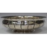 A George V Irish silver circular bowl, the shaped rim with embossed bead border and wrythen