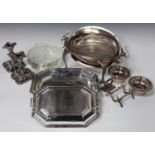 A collection of assorted plated items, including a dome-top roll-over breakfast dish, a pair of