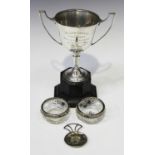 A George V silver two-handled trophy cup, Birmingham 1934, together with a silver caddy spoon,