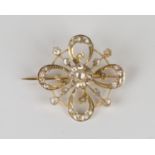 A European gold and rose cut diamond brooch, circa 1900, in a pierced quatrefoil openwork design