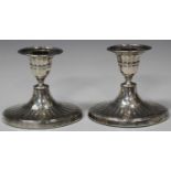 A pair of late Victorian silver stub candlesticks, each of oval form with a detachable nozzle