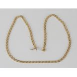 A 9ct gold faceted curblink neckchain on a snap clasp with a fold-over safety clasp, length 60cm,