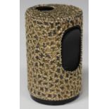 A Stuart Devlin silver gilt cylindrical table lighter sleeve with abstract textured decoration,