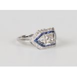 A white gold, diamond and sapphire ring, mounted with the principal circular cut diamond between