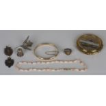 A group of mostly silver costume jewellery, comprising a gilt oval signet ring, a niello decorated