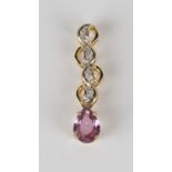 An 18ct gold, pink sapphire and diamond pendant, claw set with the pear shaped pink sapphire to