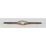 A gold, platinum fronted, diamond and cultured pearl bar brooch, circa 1910, mounted with the